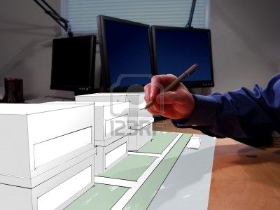 699510-an-architect-drawing-in-3d-on-his-desk.jpg
