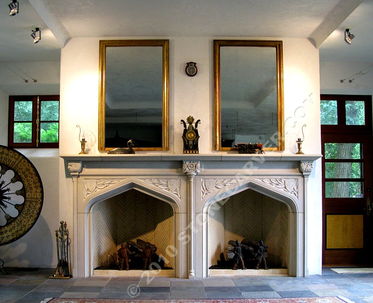 The installed limestone double wide fireplace.